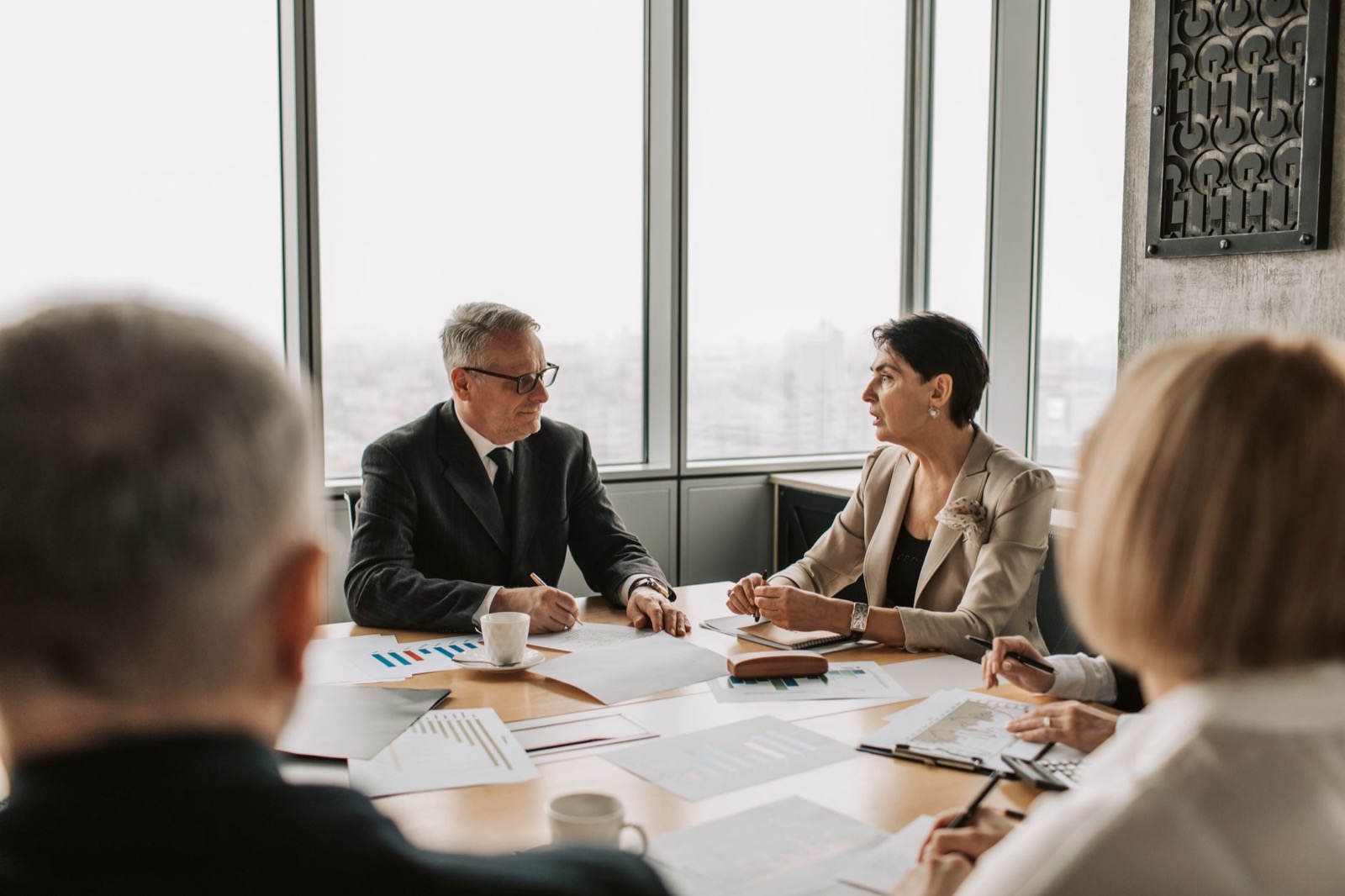 A boardroom conversation over documents